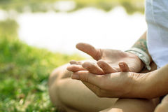 closeup-female-hands-put-yoga-mudra-woman-meditating-kundalini-sitting-outdoors-pose-nature-background-64612280